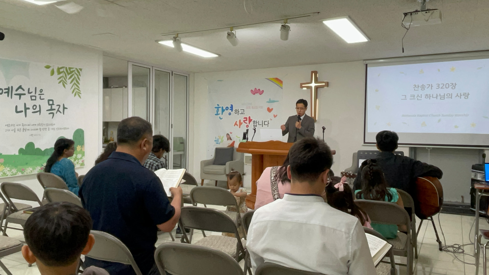 Sunday worship service with the congregation singing hymns